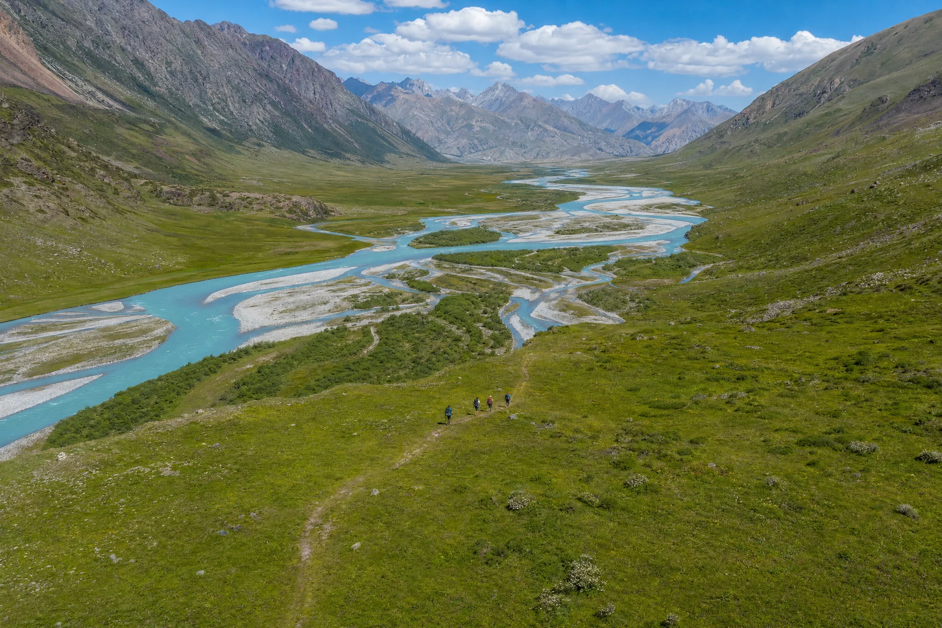 Illustrative drone view of a turquoise river winding through an alpine valley